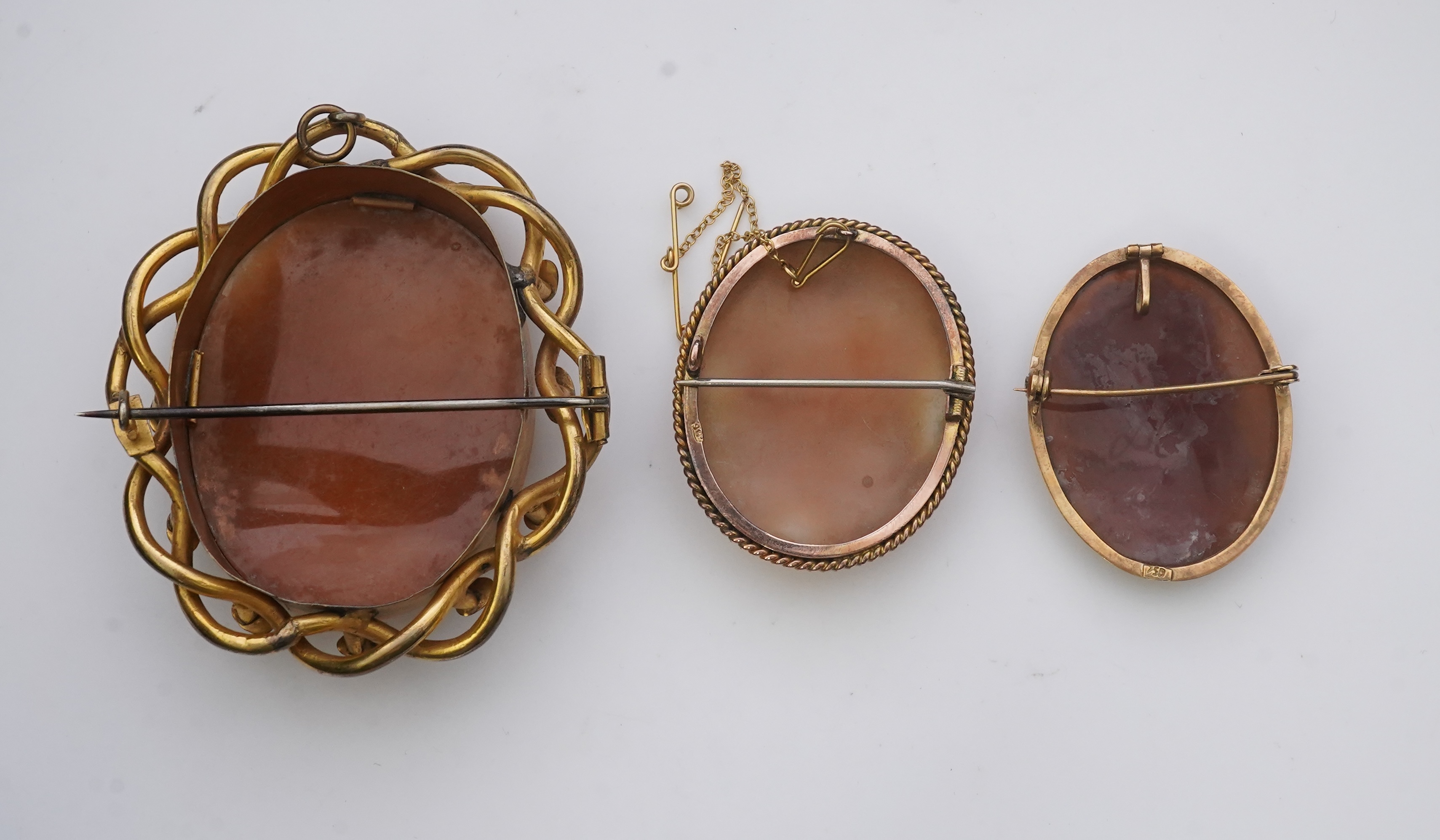 Three shell cameo brooches, 20th century